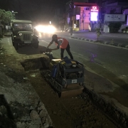 Loosening and compaction of earth removed layer of BMBC road surface for road restoration