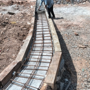 Rcc on top of dry rubble masonry for compound wall progressing near north east side of chemical house