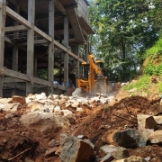 Demolishing rock for constructing compound wall