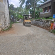 Road restoration work at Peroorkada-Krishna Nagar road-Vibrator roller compaction of WMM layer